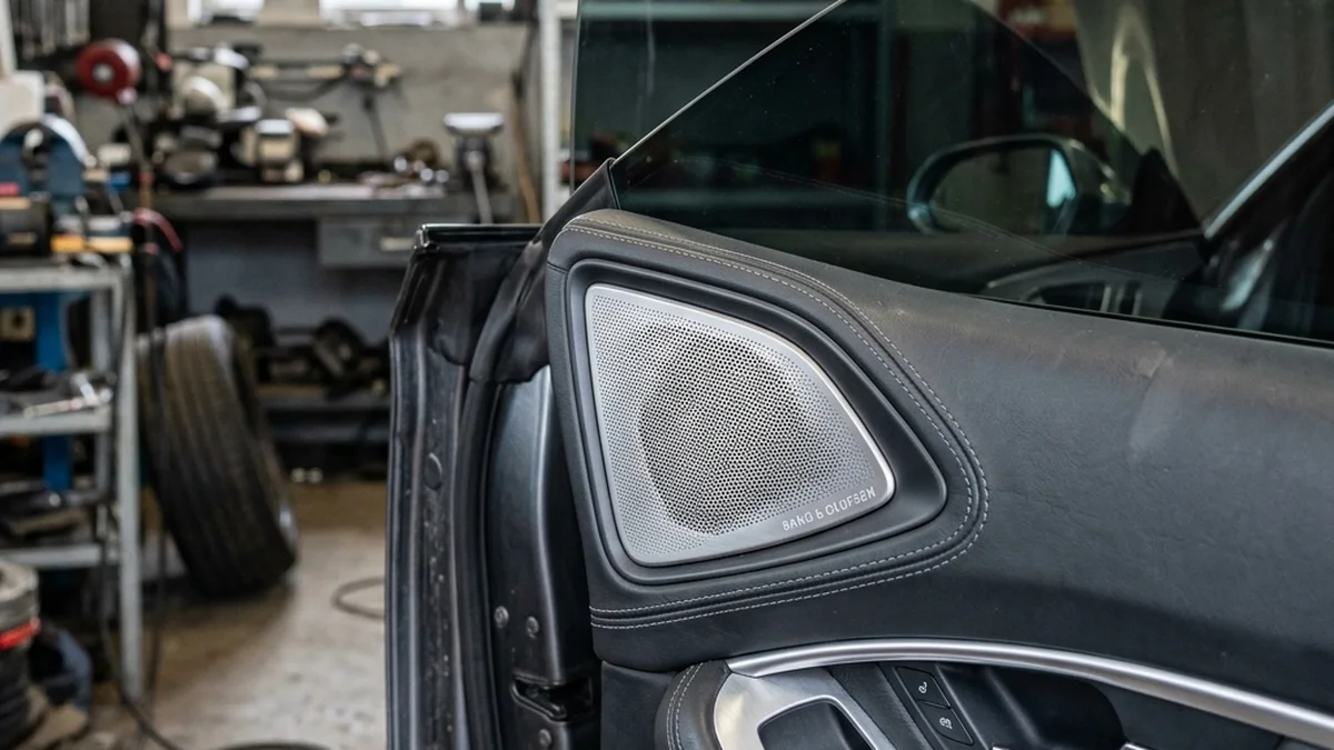 Car door speaker and tinted window